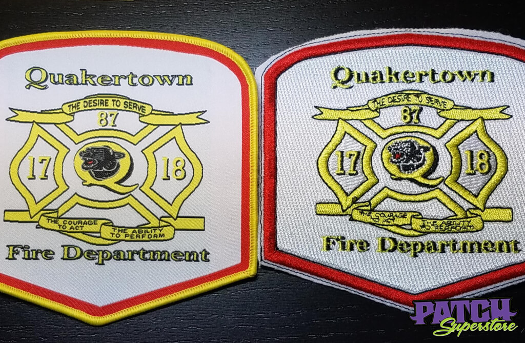two patches side by side, the one on the left is a woven patch and on the right it is a traditional embroidered patch. they say quakertown fire dept 