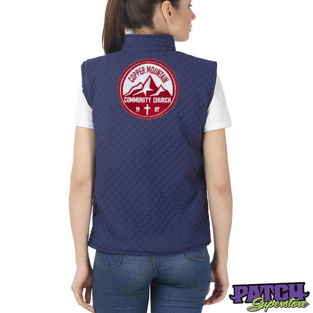 wholesale patches photo of woman with back turned wearing a vest with patch in the middle 