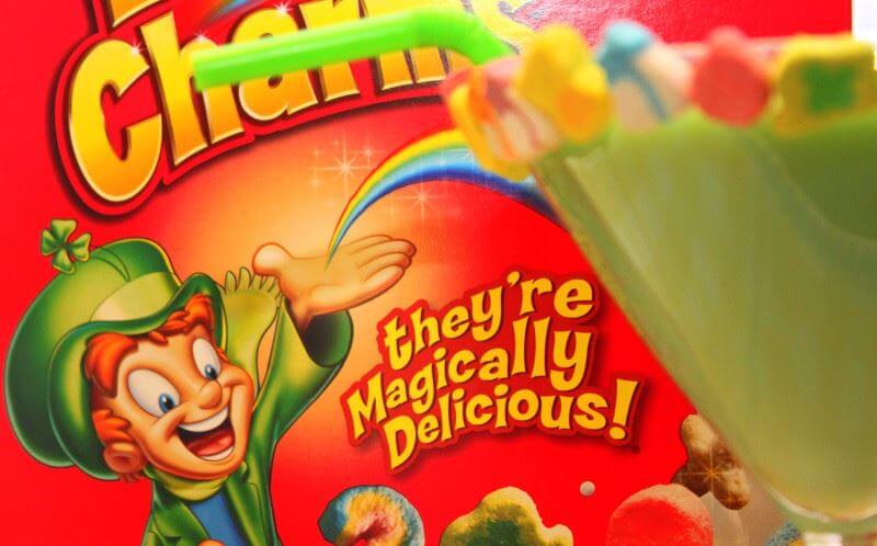 food and beverage slogans lucky charms close up of their slogan on the cereal box "they're magically delicious"